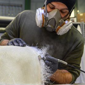 guy cutting fibreglass