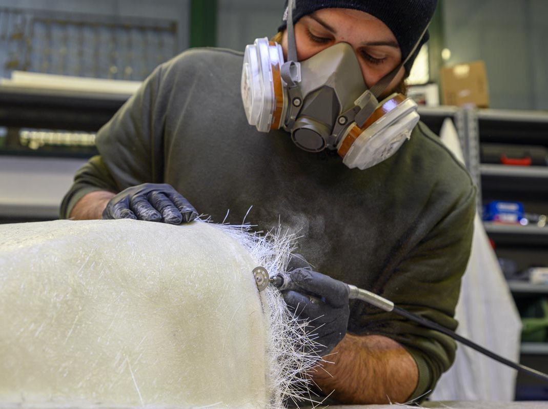 guy cutting fibreglass